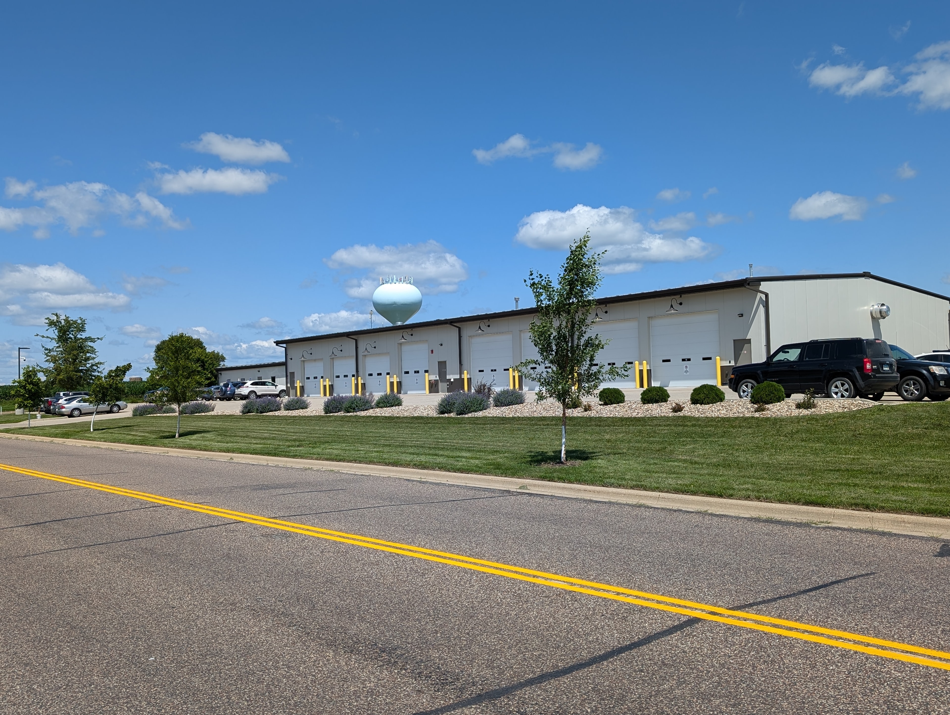 GRE facility — commercial steel building with multiple overhead doors