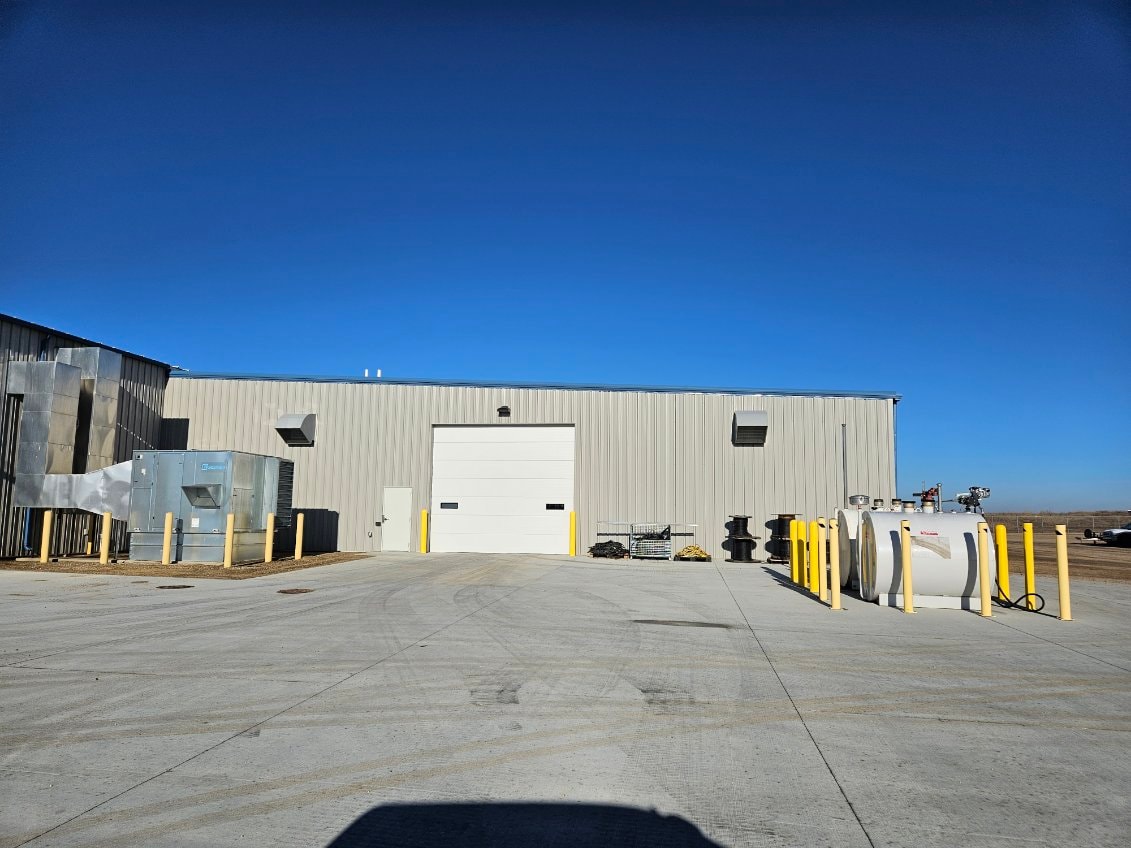 GRE facility — close-up exterior with overhead door