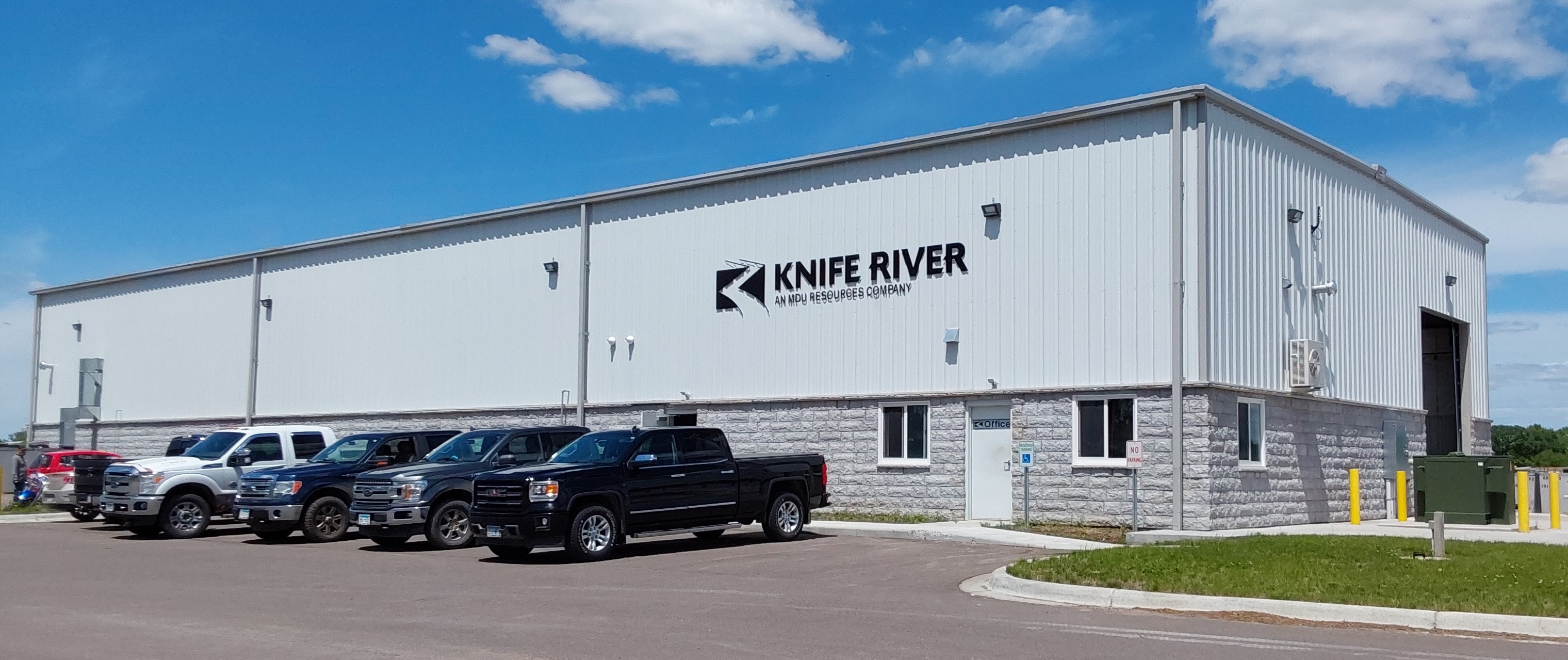 Knife River facility — pre-engineered metal building with stone base